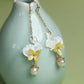 Rabbit and osmanthus-inspired earrings shown from another angle