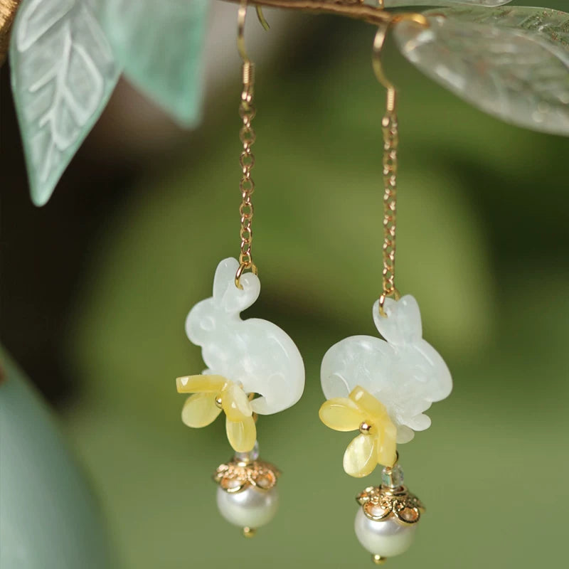 Detailed view of the rabbit and flower earring design