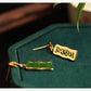 Reverse side of a green bamboo segment stud earring with openwork backing
