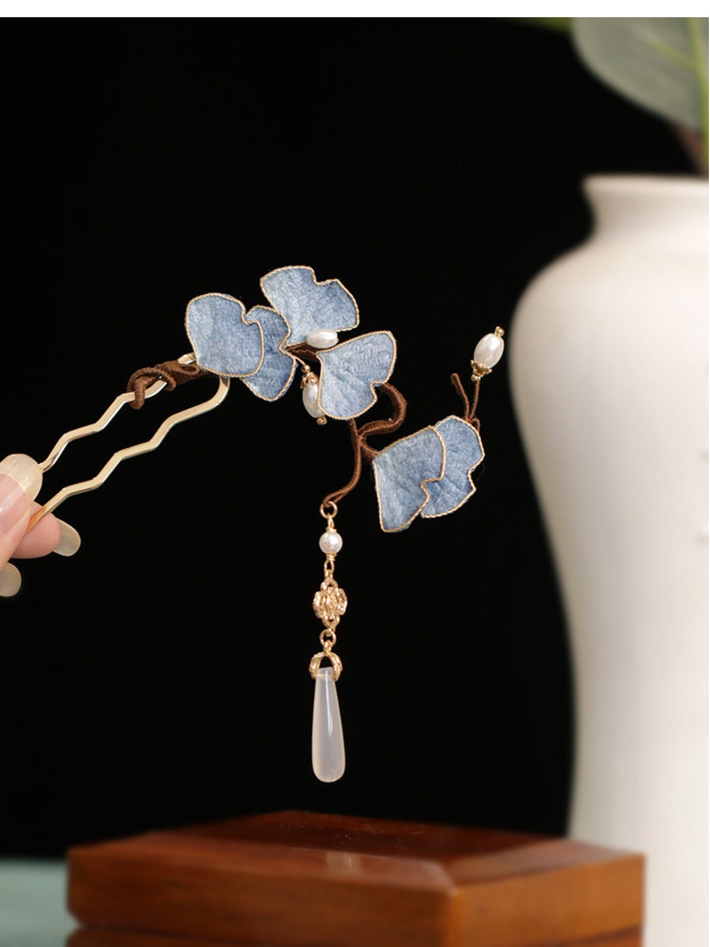 Yellow ginkgo leaf hairpin worn in a traditional style updo