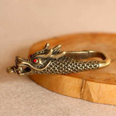 Golden dragon and red eye brass keychain
